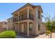 Two-story home with front porch and balcony at 847 E Agua Fria Ln, Avondale, AZ 85323