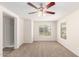 Spacious bedroom with neutral carpet and ceiling fan at 847 E Agua Fria Ln, Avondale, AZ 85323