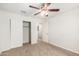Bedroom with ceiling fan and closet at 847 E Agua Fria Ln, Avondale, AZ 85323