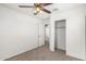 Bedroom with ceiling fan, carpet, and closet at 847 E Agua Fria Ln, Avondale, AZ 85323