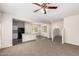 Open living room with view of kitchen and staircase at 847 E Agua Fria Ln, Avondale, AZ 85323