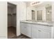 Double vanity bathroom with light colored cabinets at 847 E Agua Fria Ln, Avondale, AZ 85323