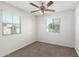 Bright bedroom with ceiling fan and carpet flooring at 847 E Agua Fria Ln, Avondale, AZ 85323