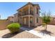 Two-story home with front porch and balcony at 847 E Agua Fria Ln, Avondale, AZ 85323