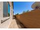Landscaped side yard with gravel and block wall at 847 E Agua Fria Ln, Avondale, AZ 85323