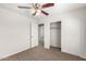 Bedroom with ceiling fan and closet at 847 E Agua Fria Ln, Avondale, AZ 85323