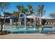 Refreshing community pool with water features and shaded seating at 2428 W Rowel Rd, Phoenix, AZ 85085