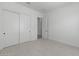 Light and airy bedroom with double doors leading to a closet at 2190 E Nolan Pl, Chandler, AZ 85249