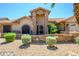 Two-story home with stone accents and landscaped yard at 9565 W Marco Polo Rd, Peoria, AZ 85382