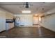 Spacious garage with storage cabinets and epoxy flooring at 9565 W Marco Polo Rd, Peoria, AZ 85382