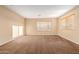 Well-lit bedroom with carpet and window blinds at 17797 W Carmen Dr, Surprise, AZ 85388