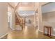 Two-story entryway with a staircase and tile flooring at 17797 W Carmen Dr, Surprise, AZ 85388