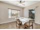 Bright breakfast nook with a table and chairs, overlooking the backyard at 17797 W Carmen Dr, Surprise, AZ 85388