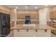 Spacious kitchen with an island, stainless steel appliances, and ample cabinetry at 17797 W Carmen Dr, Surprise, AZ 85388