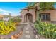 Front yard with pathway, desert plants, and a stone border at 17797 W Carmen Dr, Surprise, AZ 85388