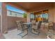Covered patio with seating area, perfect for outdoor dining at 17797 W Carmen Dr, Surprise, AZ 85388