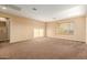 Large bedroom featuring neutral walls and carpet at 17797 W Carmen Dr, Surprise, AZ 85388