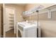 Bright laundry room, washer, dryer, shelving and spacious storage at 17797 W Carmen Dr, Surprise, AZ 85388