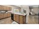 Eat-in kitchen with island and stainless steel appliances at 17797 W Carmen Dr, Surprise, AZ 85388