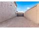 Side yard with gate access and gravel ground at 17797 W Carmen Dr, Surprise, AZ 85388
