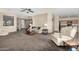 Open living room with views into the kitchen and entryway at 17797 W Carmen Dr, Surprise, AZ 85388