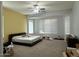 Spacious Primary bedroom with large windows and a ceiling fan at 2515 W Minton St, Phoenix, AZ 85041
