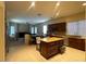 Open kitchen with large island, breakfast bar, and view into living area at 2515 W Minton St, Phoenix, AZ 85041