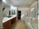 Main bathroom with double vanity and walk-in closet at 2515 W Minton St, Phoenix, AZ 85041