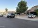 Residential street with houses and parked cars at 3028 E Friess Dr, Phoenix, AZ 85032