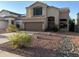 Two-story house with a brown garage door and landscaped front yard at 3028 E Friess Dr, Phoenix, AZ 85032