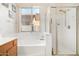 Bathroom featuring a shower and a large tub at 15468 W Tasha Cir, Surprise, AZ 85374