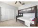 Bedroom with bunk bed and double door closet at 15468 W Tasha Cir, Surprise, AZ 85374