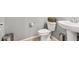 Clean and updated bathroom with pedestal sink and tile floor at 21243 W Coronado Rd, Buckeye, AZ 85396