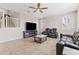 Gathering room with a fireplace, comfortable seating, and large TV at 21243 W Coronado Rd, Buckeye, AZ 85396