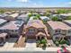 Aerial view of a house and neighborhood with solar panels at 21243 W Coronado Rd, Buckeye, AZ 85396