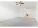 Spacious bedroom with carpeted floor and ceiling fan at 21243 W Coronado Rd, Buckeye, AZ 85396