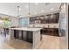 Open kitchen features a large island, stainless steel appliances, and ample cabinet space at 21243 W Coronado Rd, Buckeye, AZ 85396