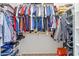 Walk-in closet offers hanging space and shoe storage at 21243 W Coronado Rd, Buckeye, AZ 85396
