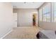 Bright bedroom with walk-in closet and neutral walls at 21243 W Coronado Rd, Buckeye, AZ 85396