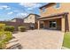 Backyard with paver patio, built-in grill and lush landscaping at 21243 W Coronado Rd, Buckeye, AZ 85396