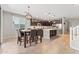 Kitchen features breakfast nook with island and dark wood cabinets at 21243 W Coronado Rd, Buckeye, AZ 85396