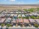 Wide aerial view of neighborhood featuring numerous homes with solar panels at 21243 W Coronado Rd, Buckeye, AZ 85396