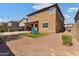 Spacious backyard with artificial turf, playset and paver patio at 21243 W Coronado Rd, Buckeye, AZ 85396