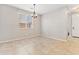Bright dining room with tile flooring and a chandelier at 21243 W Coronado Rd, Buckeye, AZ 85396