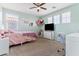 bedroom with a bed, desk, and TV at 21243 W Coronado Rd, Buckeye, AZ 85396