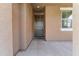 Front door entryway with tile flooring and a welcome mat at 21243 W Coronado Rd, Buckeye, AZ 85396