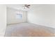 Bright bedroom featuring a large window and ceiling fan at 21243 W Coronado Rd, Buckeye, AZ 85396