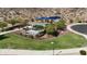 Community playground with shaded seating areas at 21243 W Coronado Rd, Buckeye, AZ 85396