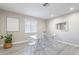 Bright dining room with glass table and four clear chairs at 8716 E Mitchell Dr, Scottsdale, AZ 85251