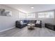 Living room with grey sectional sofa and coffee table at 8716 E Mitchell Dr, Scottsdale, AZ 85251